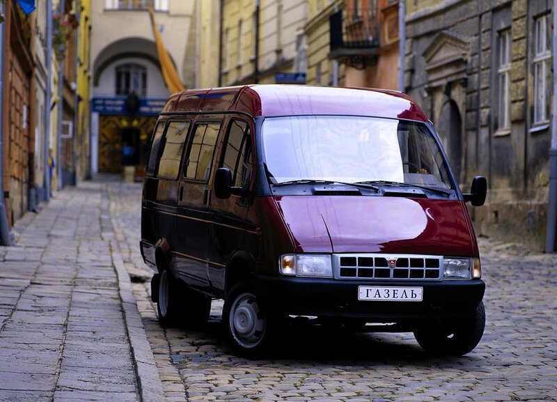 Red van on cobblestone street
