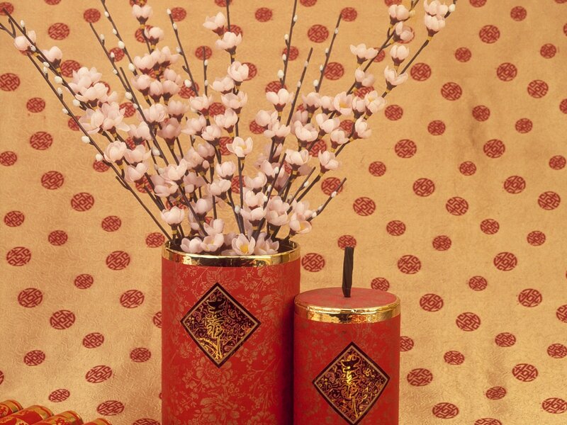 Red vases with cherry blossoms