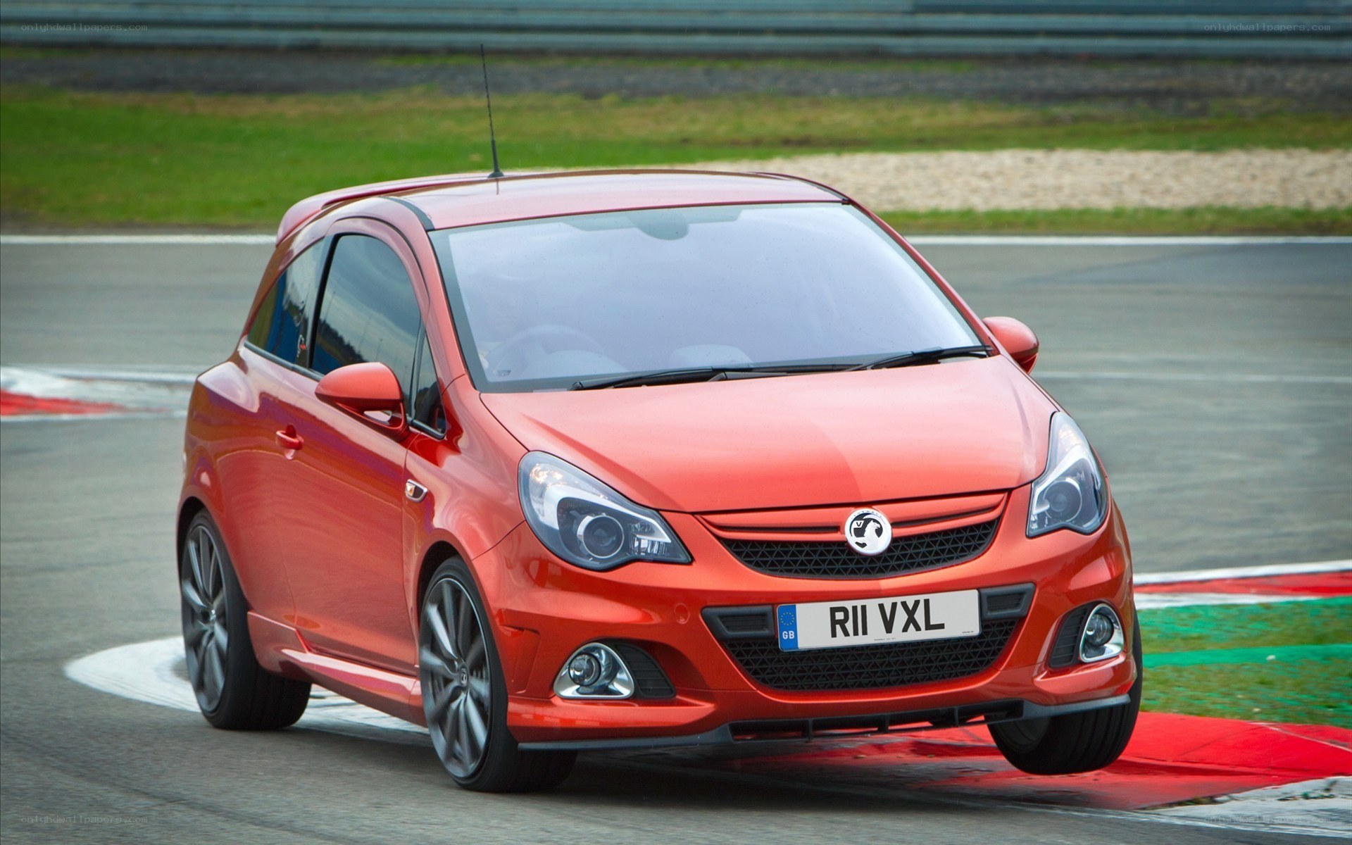 Red Vauxhall Corsa on a racetrack