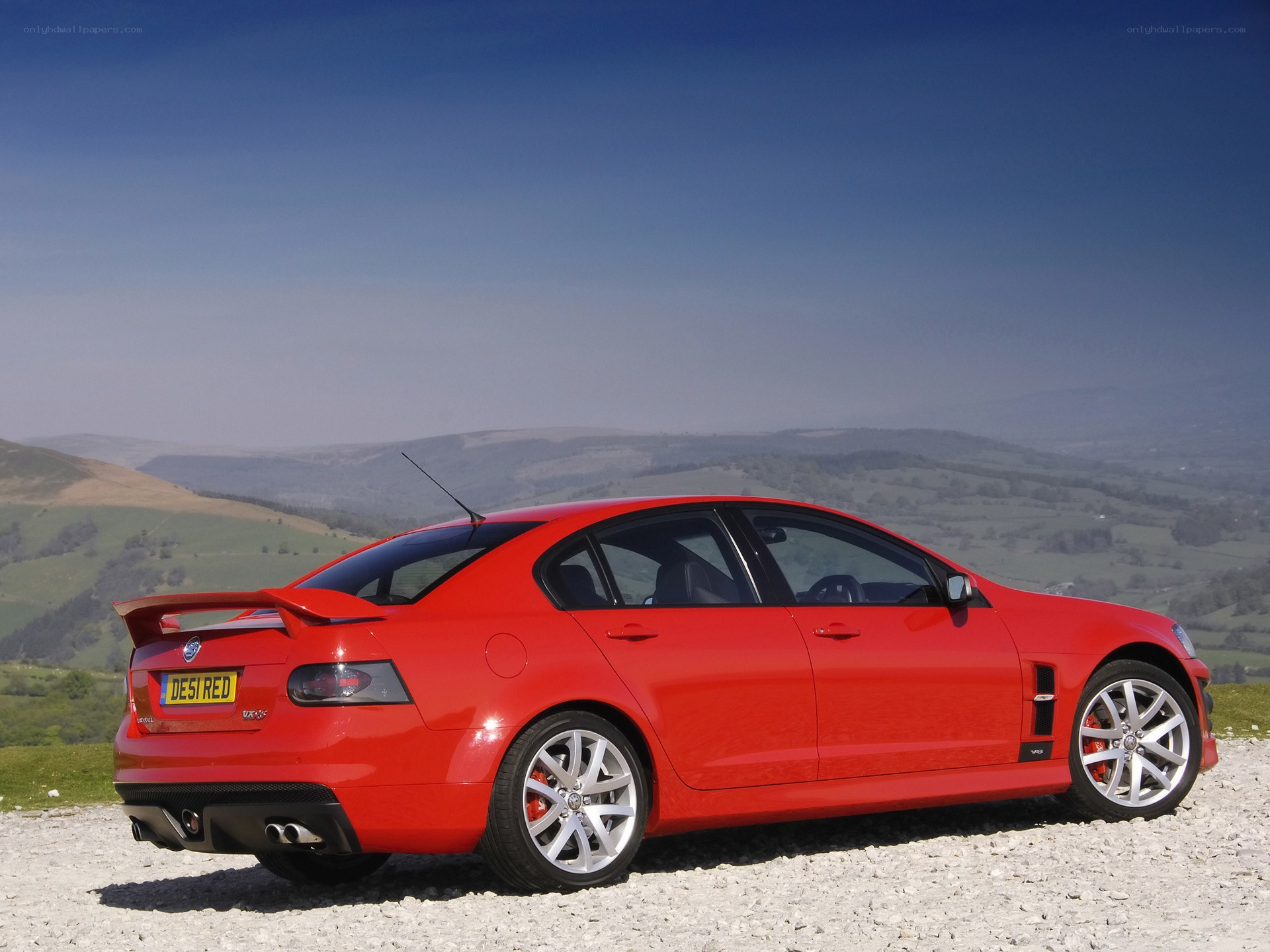 Red Vauxhall Monaro on a hill