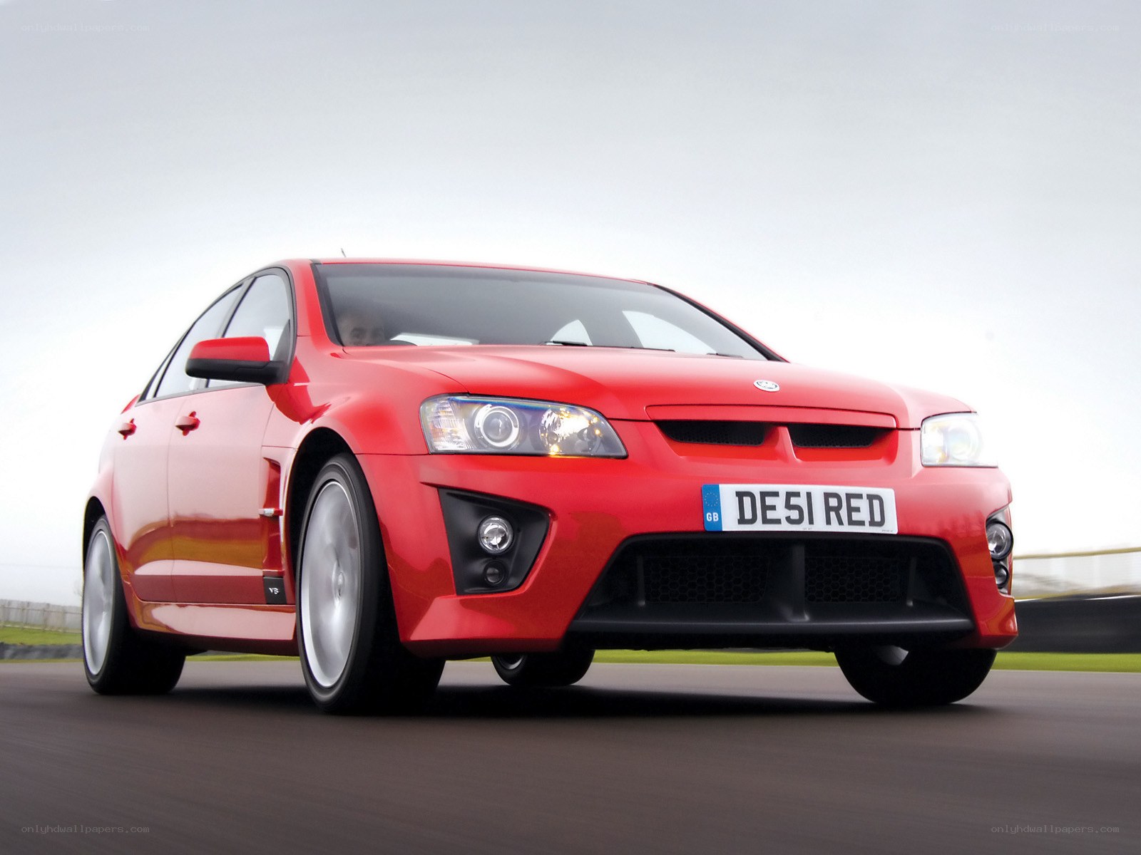 Red Vauxhall Vectra in motion