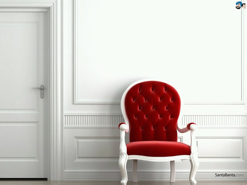 Red velvet chair in white room