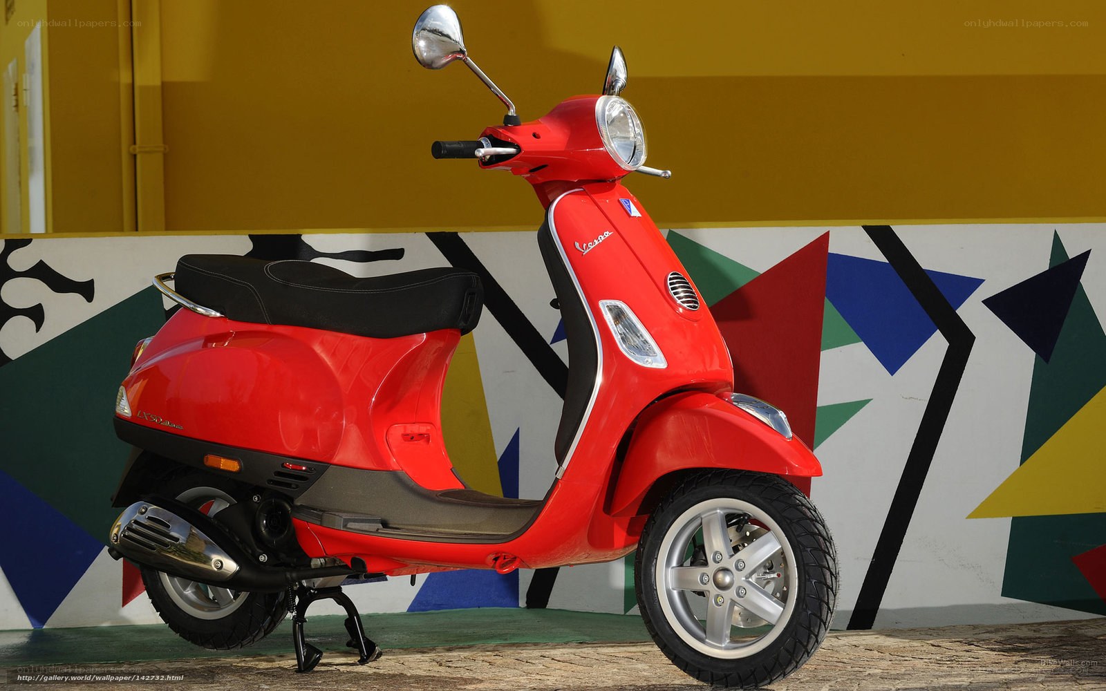 Red Vespa scooter on display