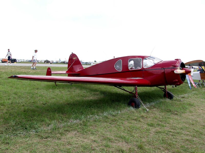 Red Vintage Airplane — Calm, Afternoon, Photograph, People