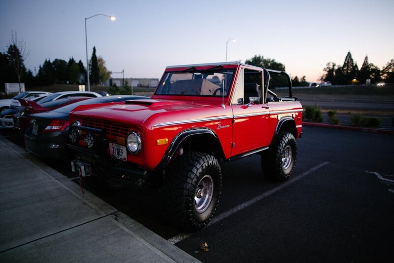 Red vintage Bronco in parking lot