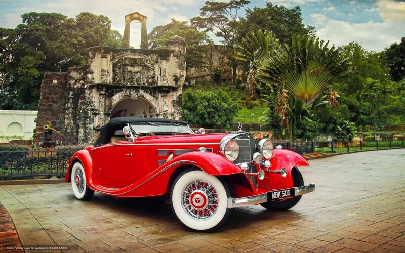 Red vintage car at historic site
