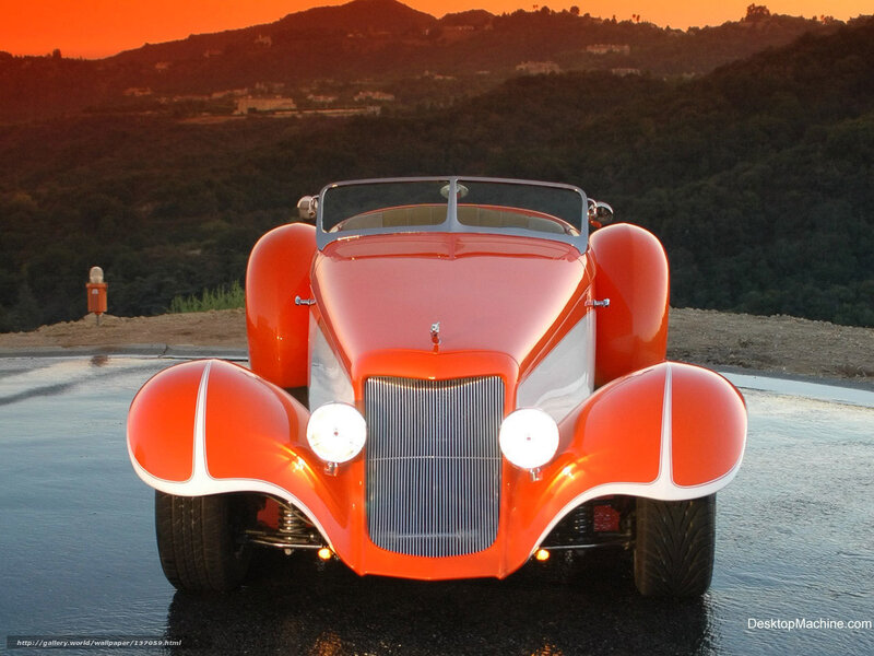 Red vintage car at sunset
