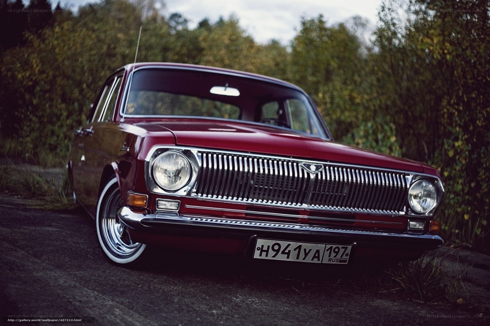 Red vintage car in forest