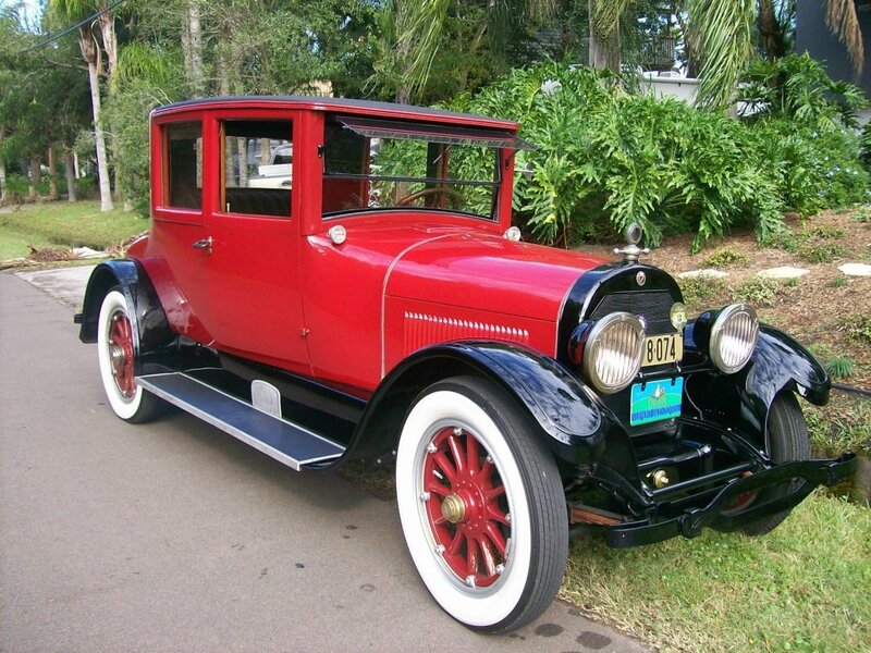 Red vintage car on a driveway