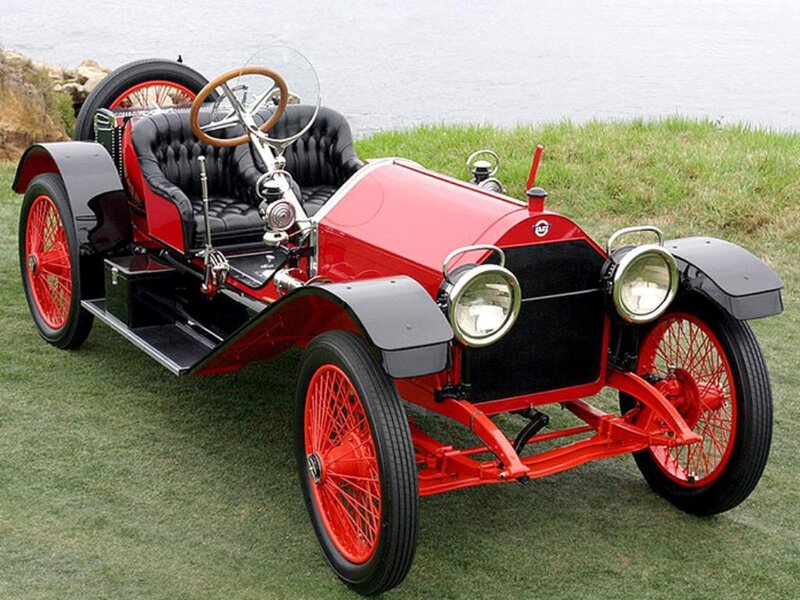 Red vintage car on grass