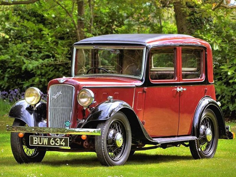 Red vintage car on grass