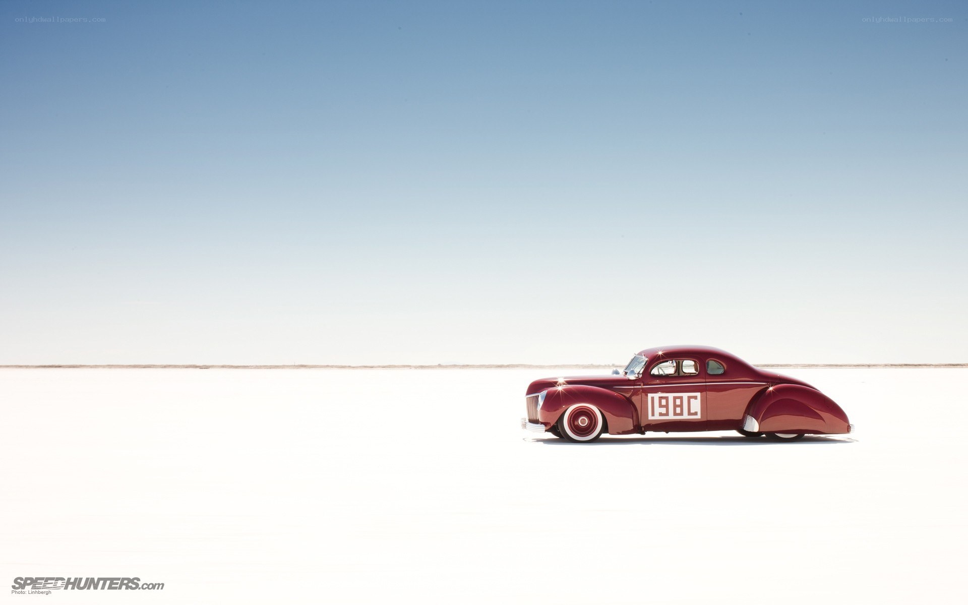 Red vintage car on salt flat