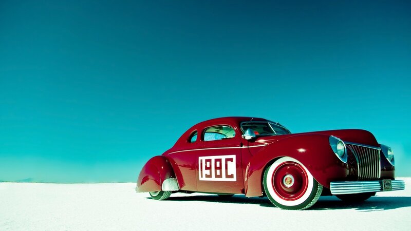 Red vintage car on salt flat