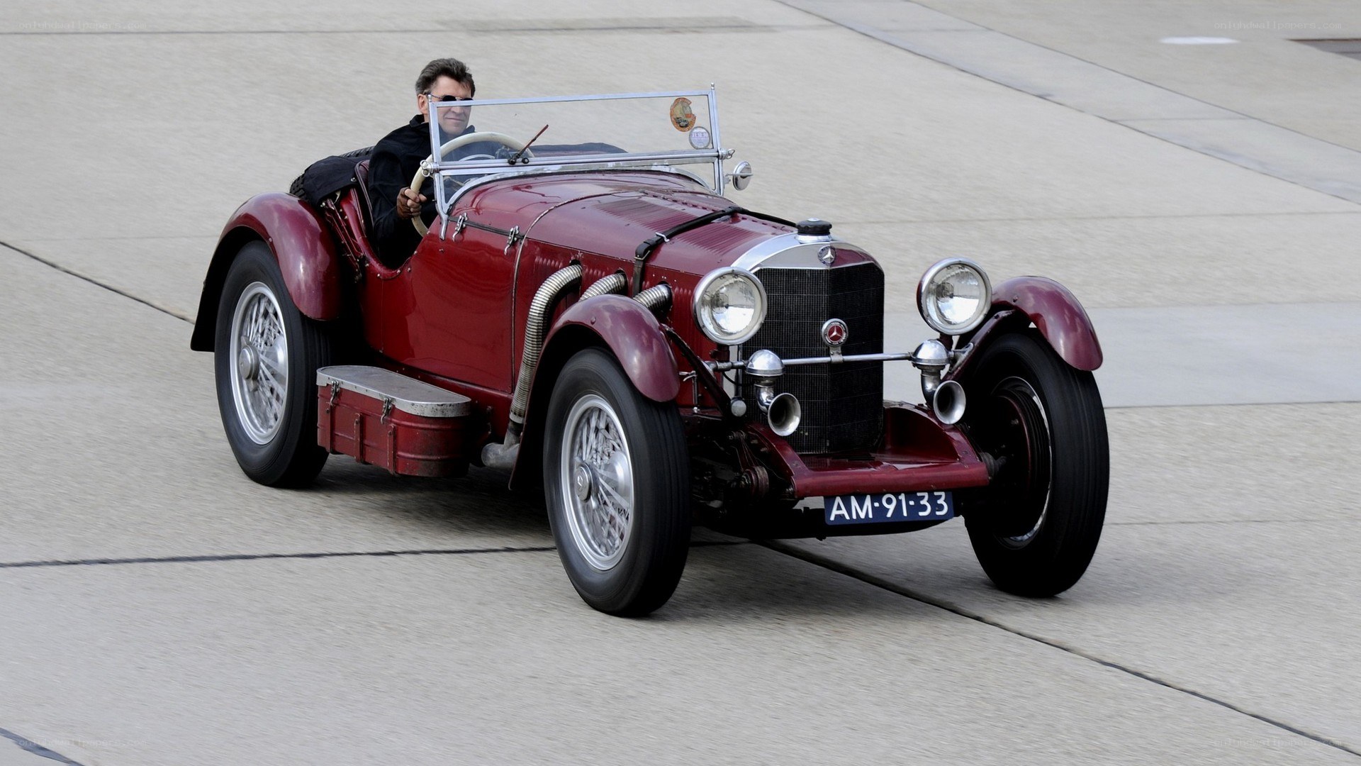 Red vintage car on track