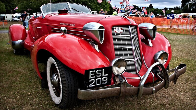 Red Vintage Car — Outdoor, Afternoon, Photograph, People, Flags