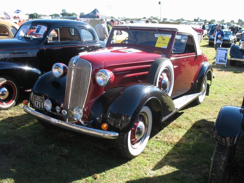 Red vintage convertible at car show