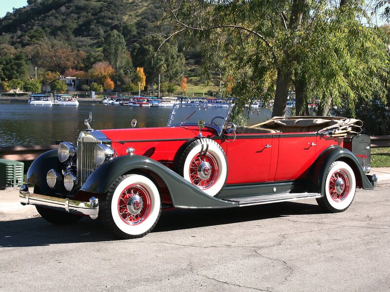 Red vintage convertible by the lake
