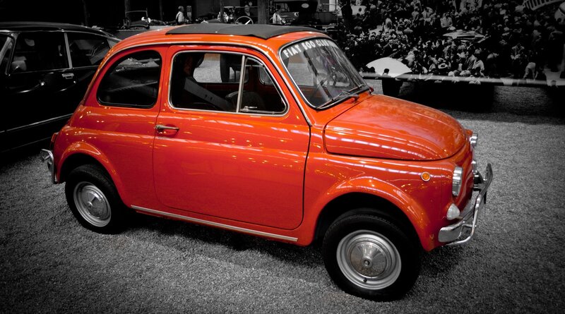 Red vintage Fiat car on display