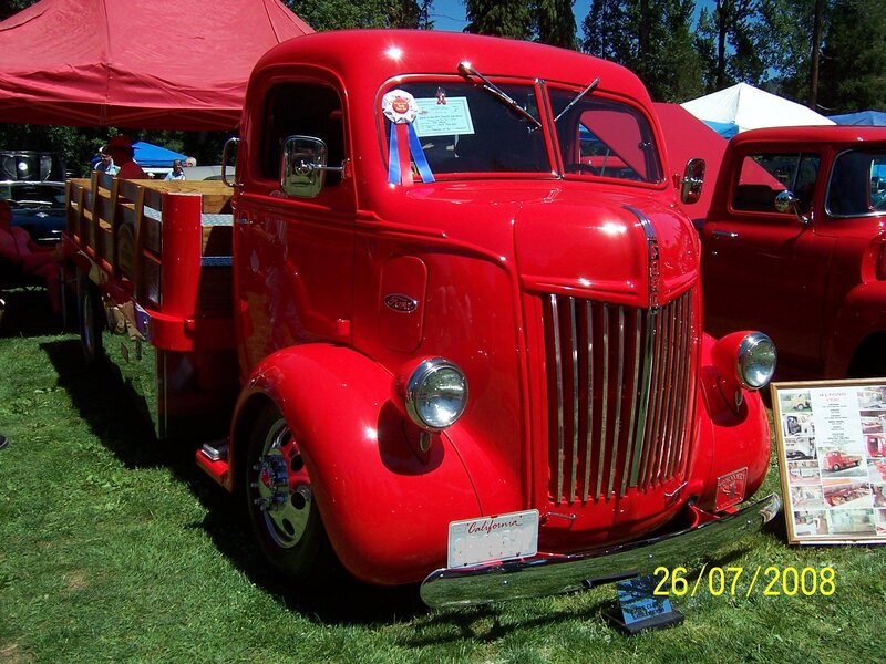 Red vintage Ford truck at show