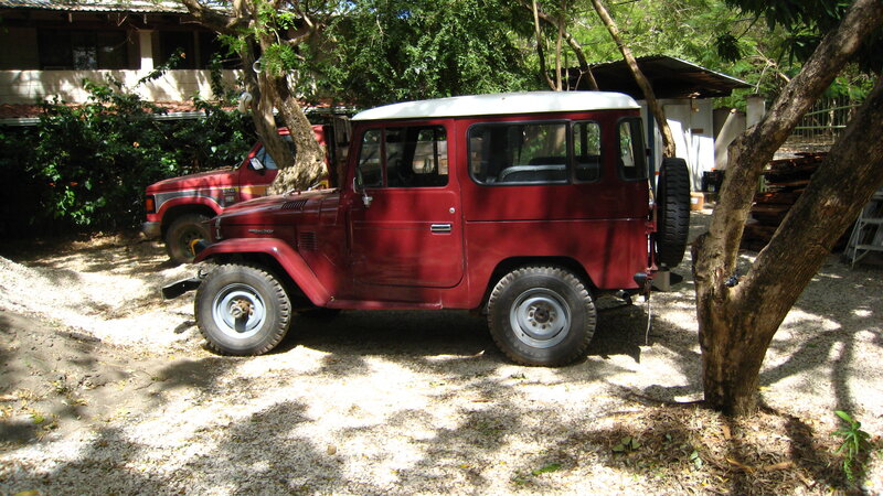 Red vintage jeep parked outdoors