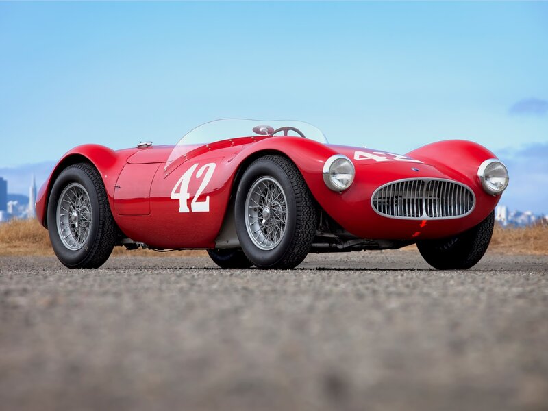Red Vintage Race Car — Calm, Afternoon, Photograph, City Skyline