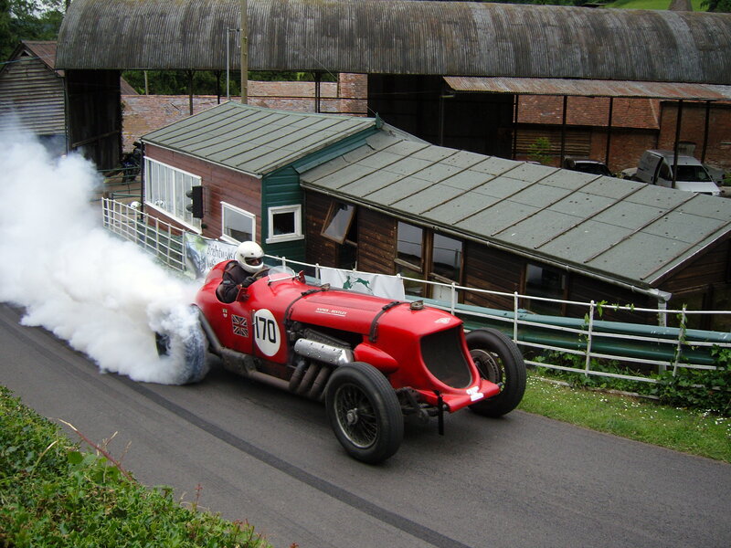 Red vintage race car on track