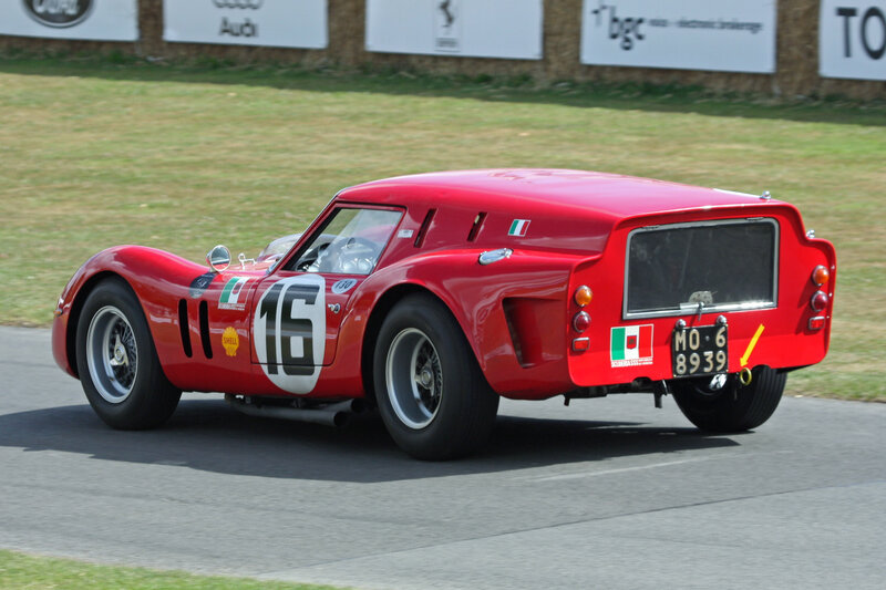 Red vintage race car on track