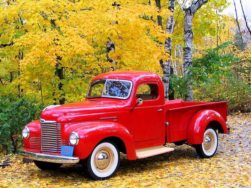 Red vintage truck in autumn