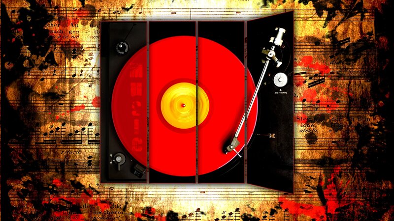 Red vinyl record on turntable