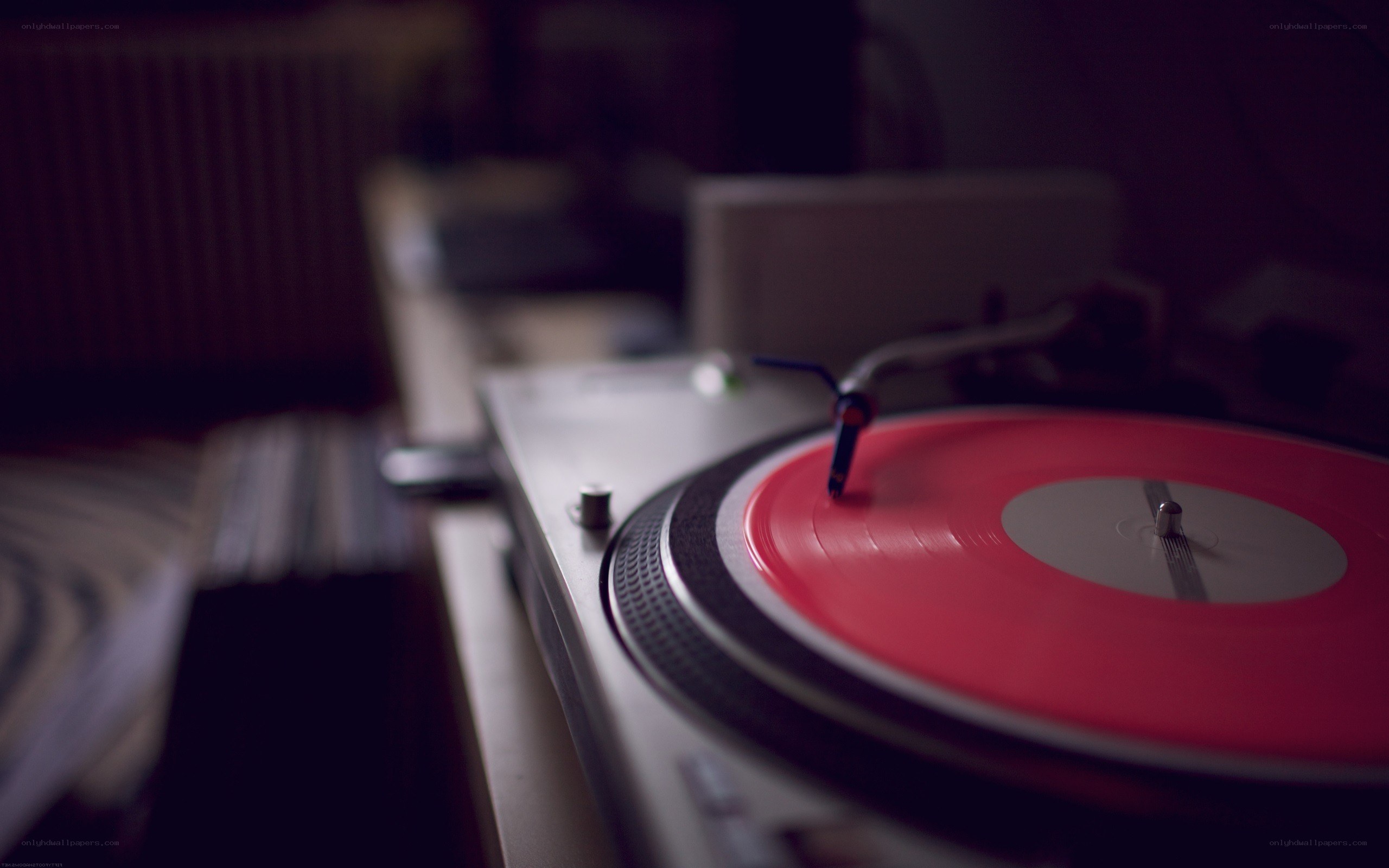 red vinyl record on turntable