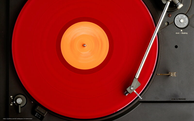 Red vinyl record on turntable