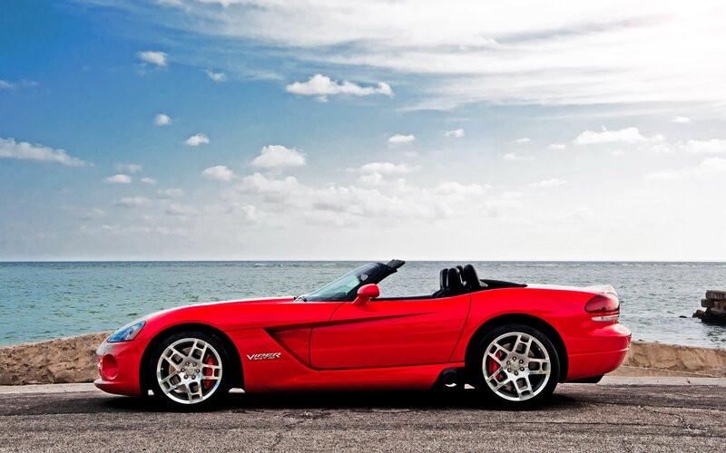 Red Viper convertible by the sea