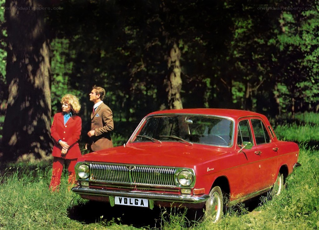 Red Volga car in a forest
