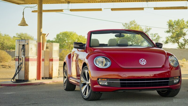Red Volkswagen Beetle at gas station