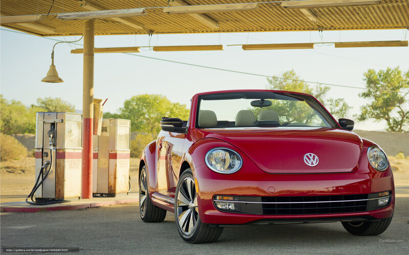 Red Volkswagen Beetle at gas station