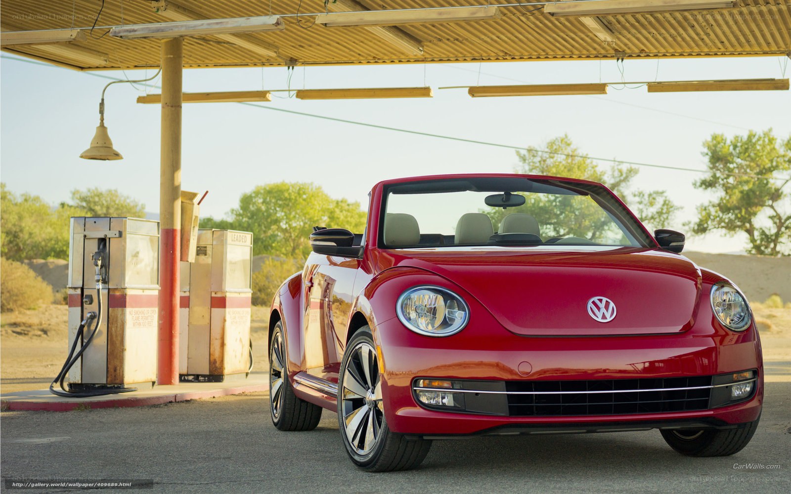 Red Volkswagen Beetle at gas station