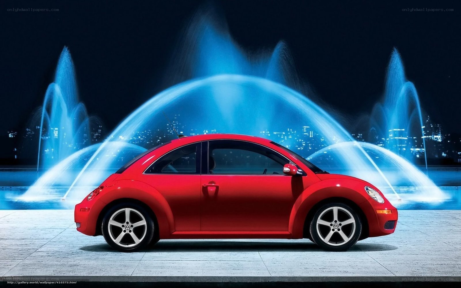 Red Volkswagen Beetle at night