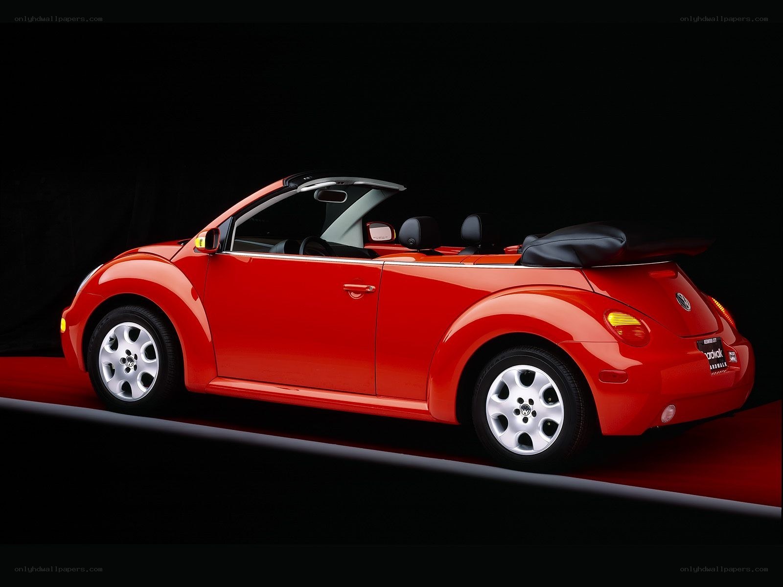 Red Volkswagen Beetle convertible