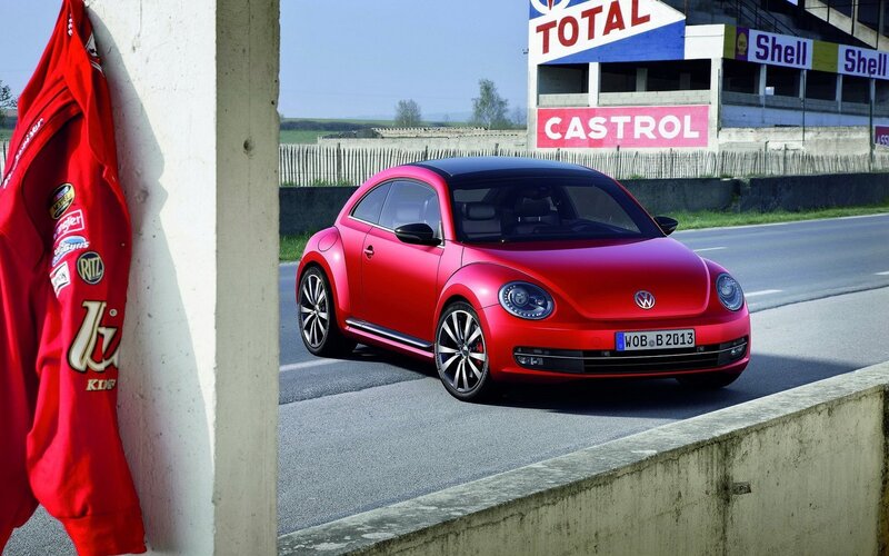 Red Volkswagen Beetle on a racetrack