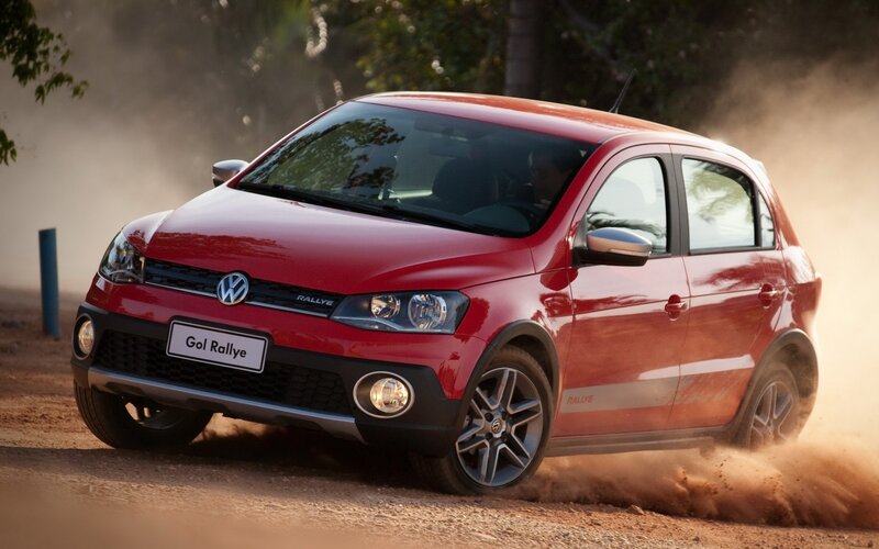 Red Volkswagen Gol Rallye on dirt road