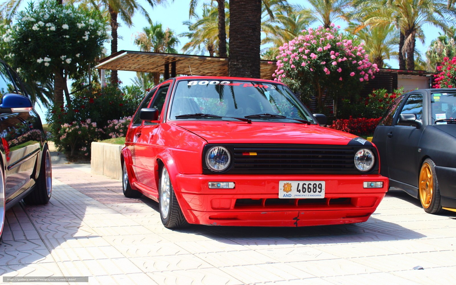 Red Volkswagen Golf in a parking lot