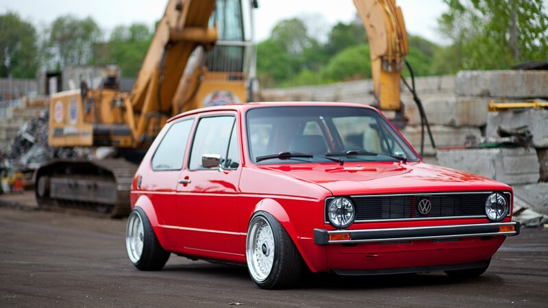 Red Volkswagen Golf in construction site