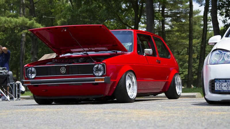 Red Volkswagen Golf with open hood