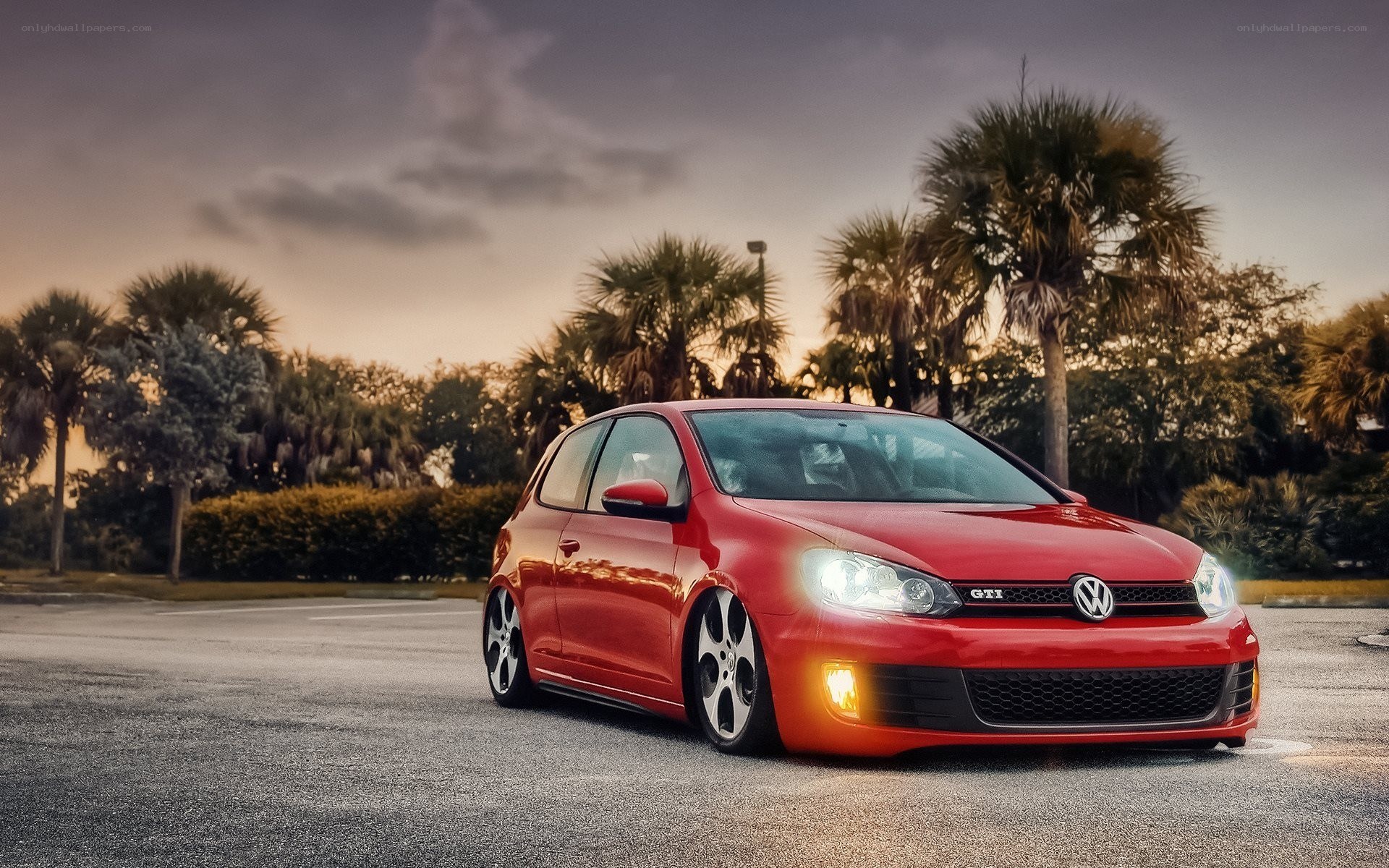 Red Volkswagen GTI at dusk