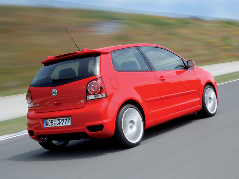 Red Volkswagen GTI in motion