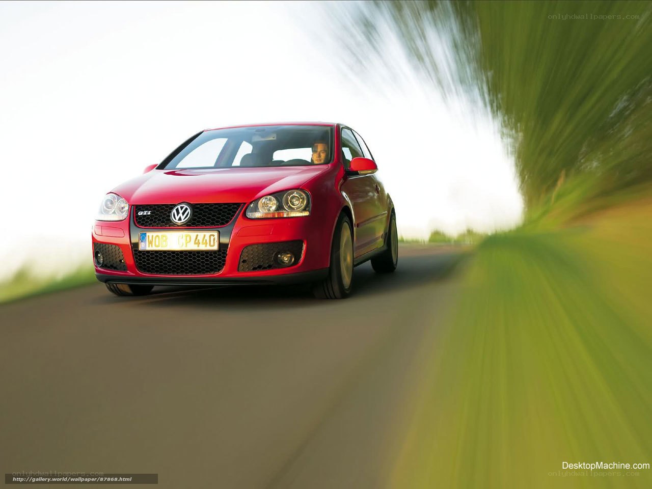 Red Volkswagen GTI in motion