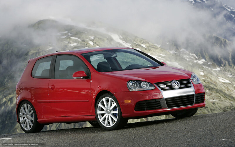 Red Volkswagen GTI on mountain road