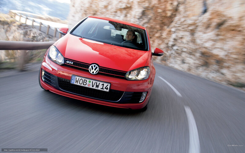 Red Volkswagen GTI on winding road
