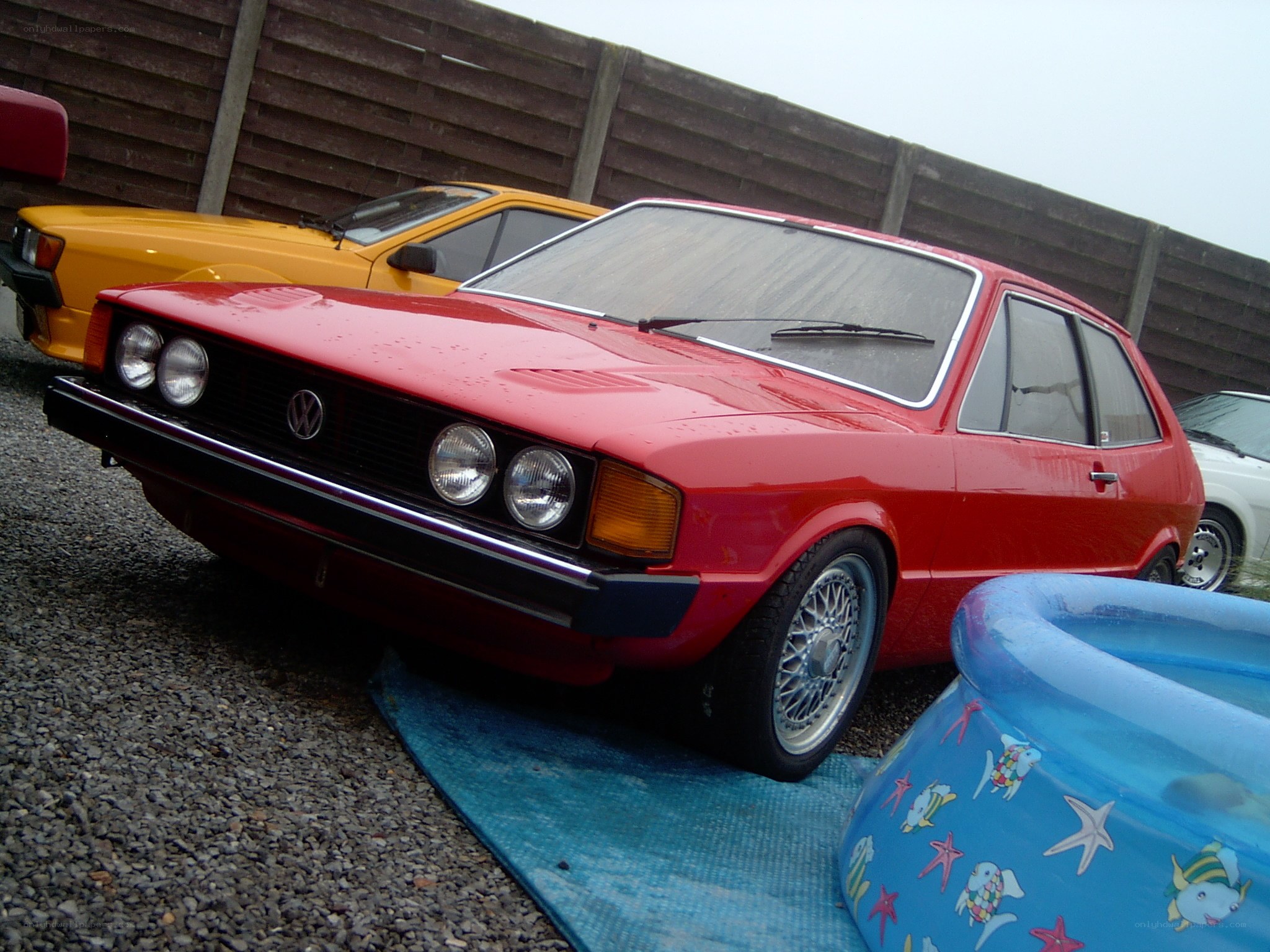 Red Volkswagen hatchback car