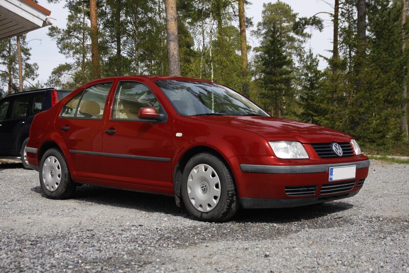 Red Volkswagen Jetta parked outside